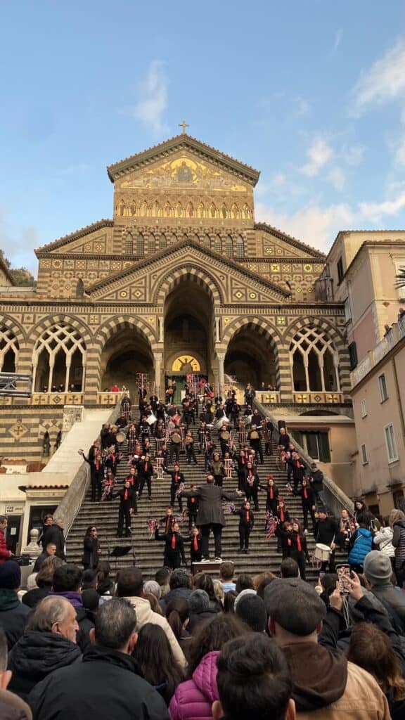Local orchestra performing on the steps of the Amalfi Cathedral during a celebration