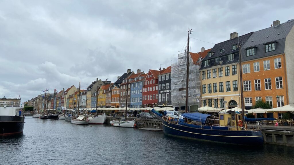 Colorful historic buildings along the Nyhavn waterfront in Copenhagen, Denmark