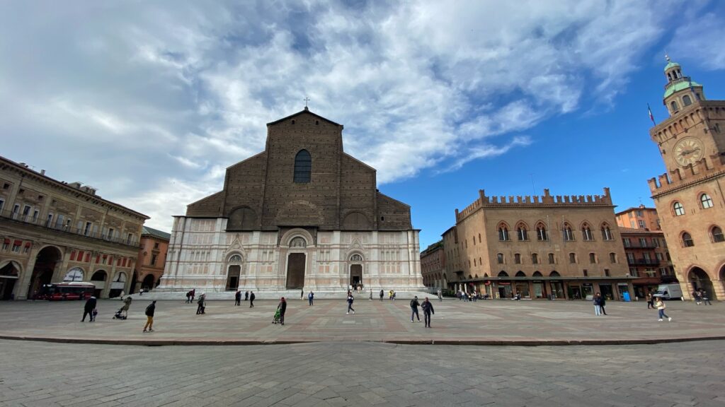 Piazza Maggiore, the main square of Bologna, surrounded by historic buildings and cafés