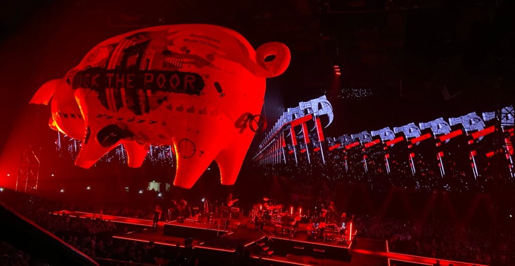 Roger Waters performing in Bologna with iconic Pink Floyd imagery and stage visuals
